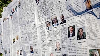 In this March 18, 2020 file photo, local newspaper Eco di Bergamo features several pages of obituaries in its March 17, 2020 edition, in Mediglia, Italy. 