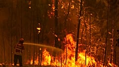 Firefighters try to extinguish a wildfire at the village of Chaveira, near Macao, in central Portugal on Monday, July 22, 2019.