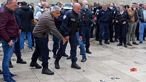 French police throw handcuffs and arm band on the ground following demonstrations against police brutality and racism. 