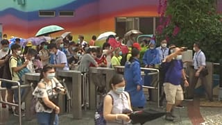 Various of people entering the park