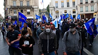 In this June 12, 2020, file photo, French police unionists demonstrate in front of the Interior Ministry in Paris.