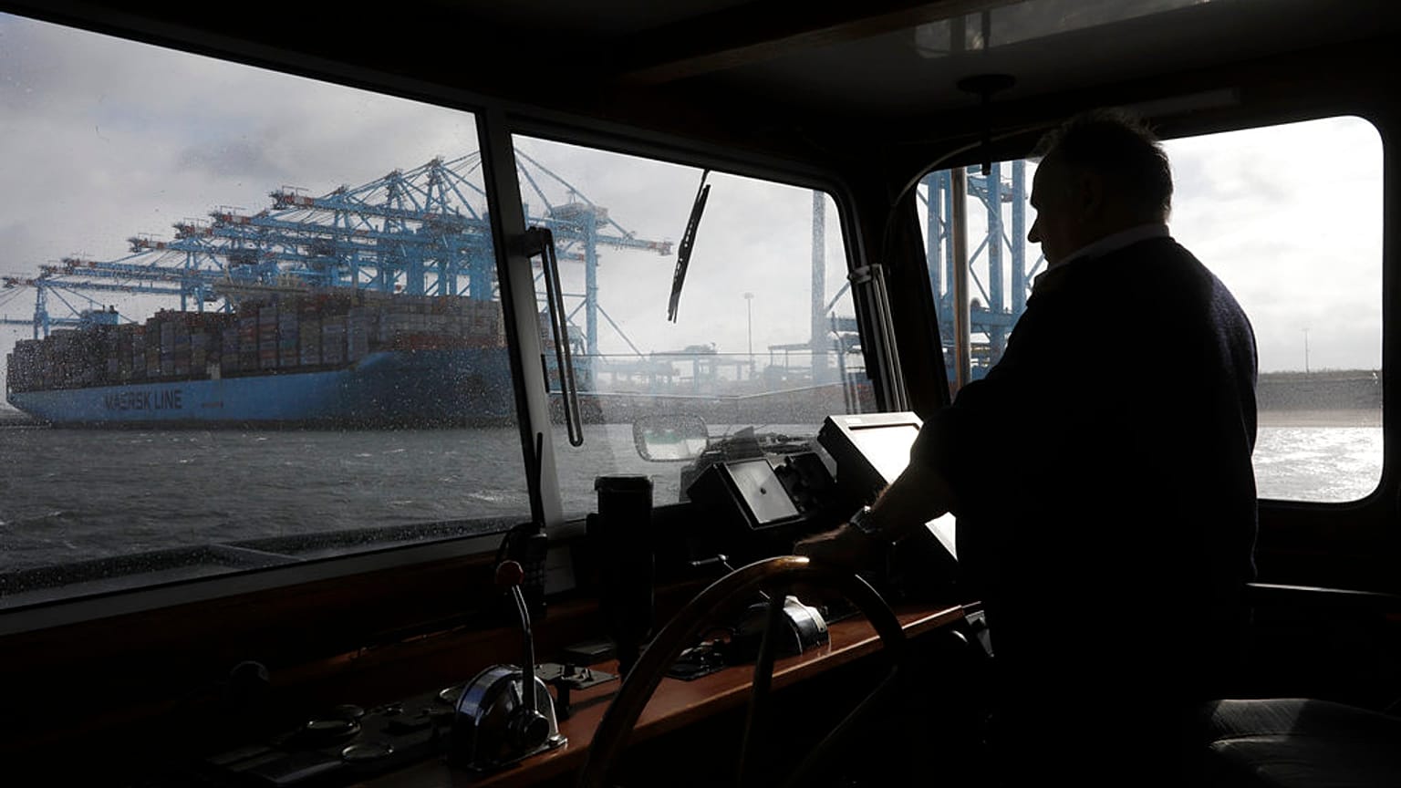 A container ship is unloaded in the harbor of Rotterdam, Netherlands, Tuesday, Sept. 11, 2018
