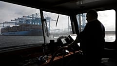 A container ship is unloaded in the harbor of Rotterdam, Netherlands, Tuesday, Sept. 11, 2018