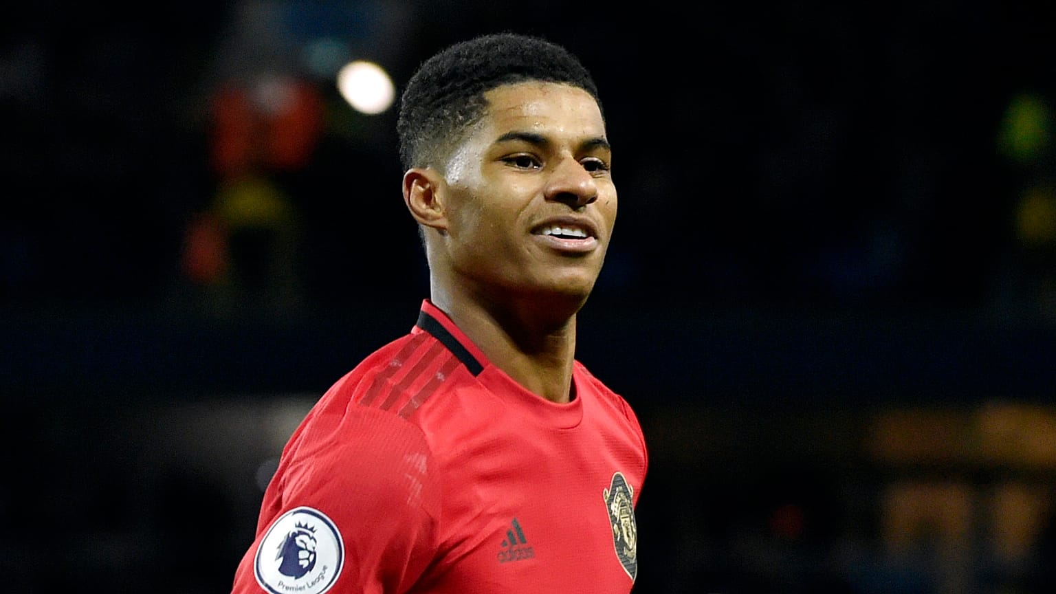 Manchester United's Marcus Rashford celebrates during an English Premier League football match against Manchester City.
