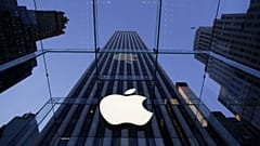 Apple logo hangs in the glass box entrance to the company's Fifth Avenue store in New York