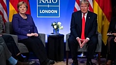 President Donald Trump meets with German Chancellor Angela Merkel during the NATO summit at The Grove, UK