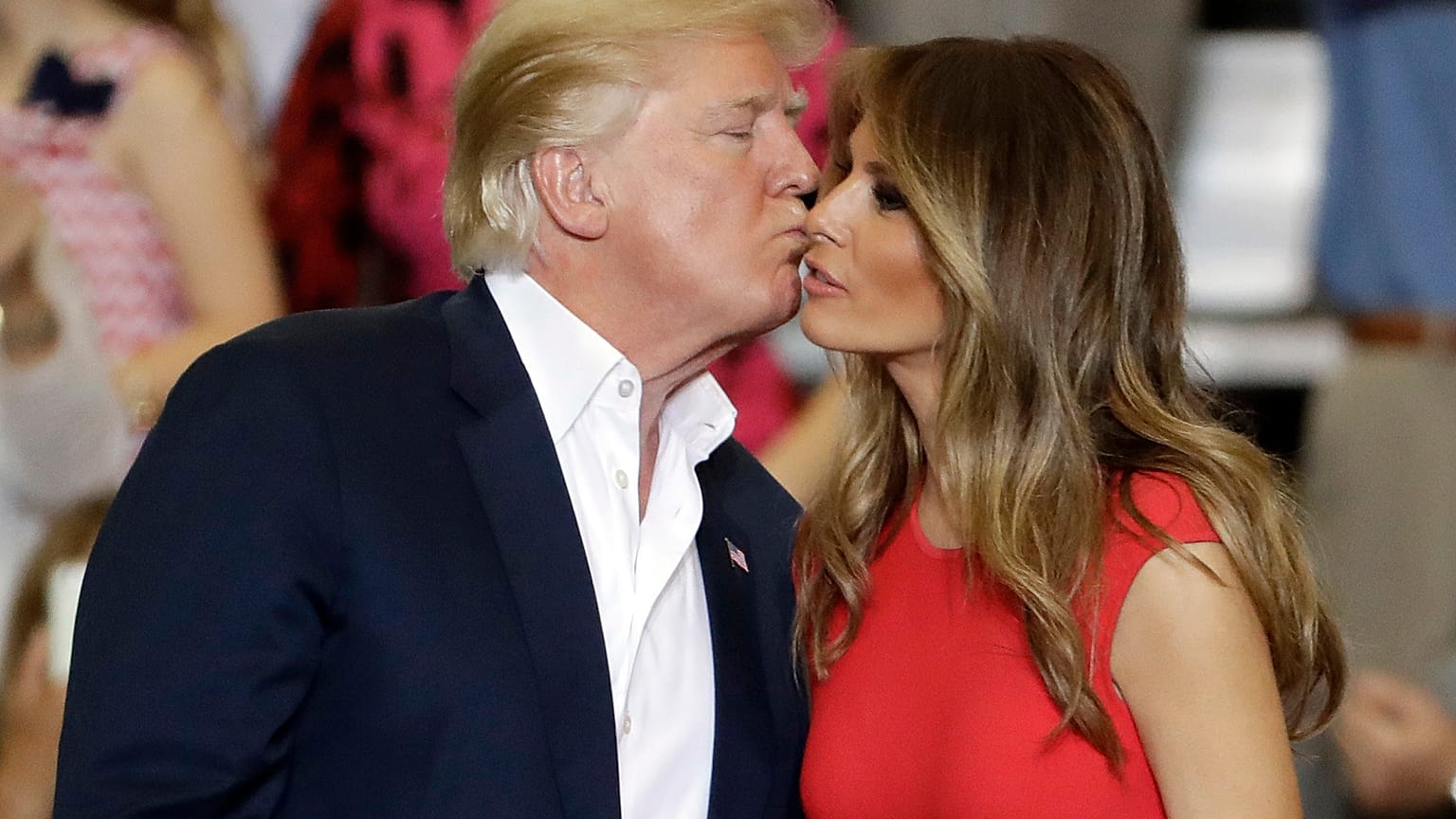 President Donald Trump kisses his wife, first lady, Melania Trump
