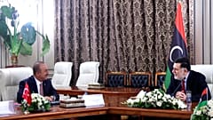 Turkey's Foreign Minister Mevlut Cavusoglu, right, and Fayez Sarraj