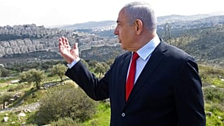 In this Feb. 20, 2020 file photo, Israeli Prime Minister Benjamin Netanyahu visits the area where a new neighborhood is to be built in the East Jerusalem settlement of Har Hom