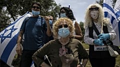 Supporters of Prime Minister Benjamin Netanyahu wear a masks, Israel
