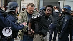 A protester is detained during an anti-racism demonstration, Thursday, June 4, 2020 in Lille, northern France