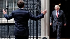 Boris Johnson greets Emmanuel Macron 