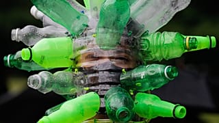 A protester wears a face shield made of recycled plastic bottles by artist Leeroy New during an anti-terror bill rally in Metro Manila, Philippines