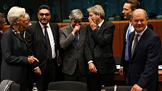 ECB President Christine Lagarde (L) with euro zone finance ministers during a January 2020 Eurogroup meeting.