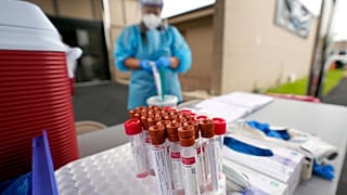Test kits sit on a table at a United Memorial Medical Center COVID-19 testing site on June 26, 2020, in Houston, Texas.