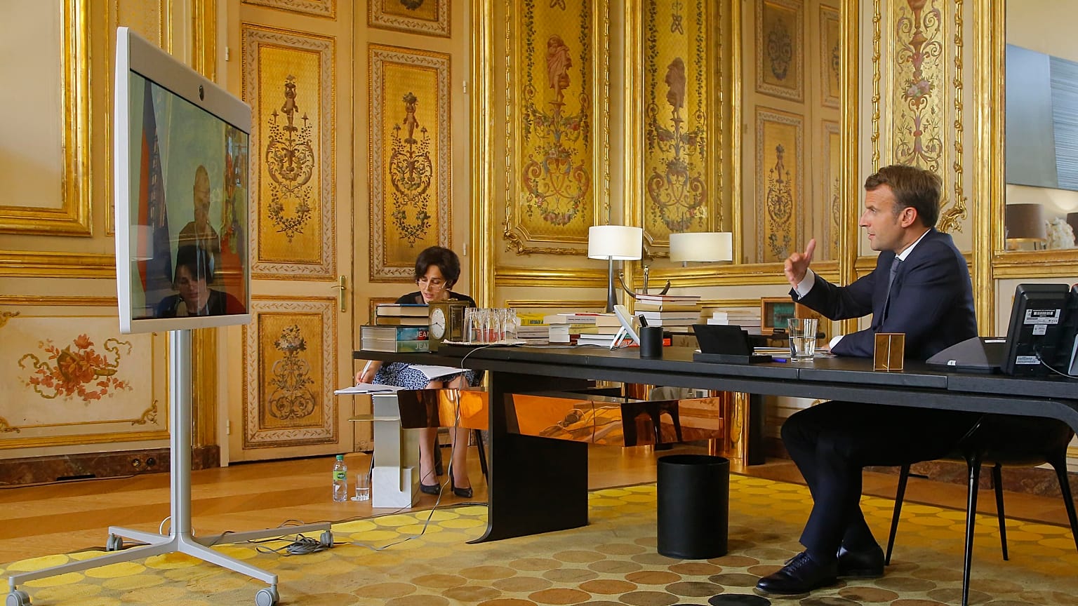 French President Emmanuel Macron talks to Russian President Vladimir Putin during a video conference Friday, June 26, 2020