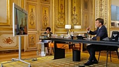French President Emmanuel Macron talks to Russian President Vladimir Putin during a video conference Friday, June 26, 2020