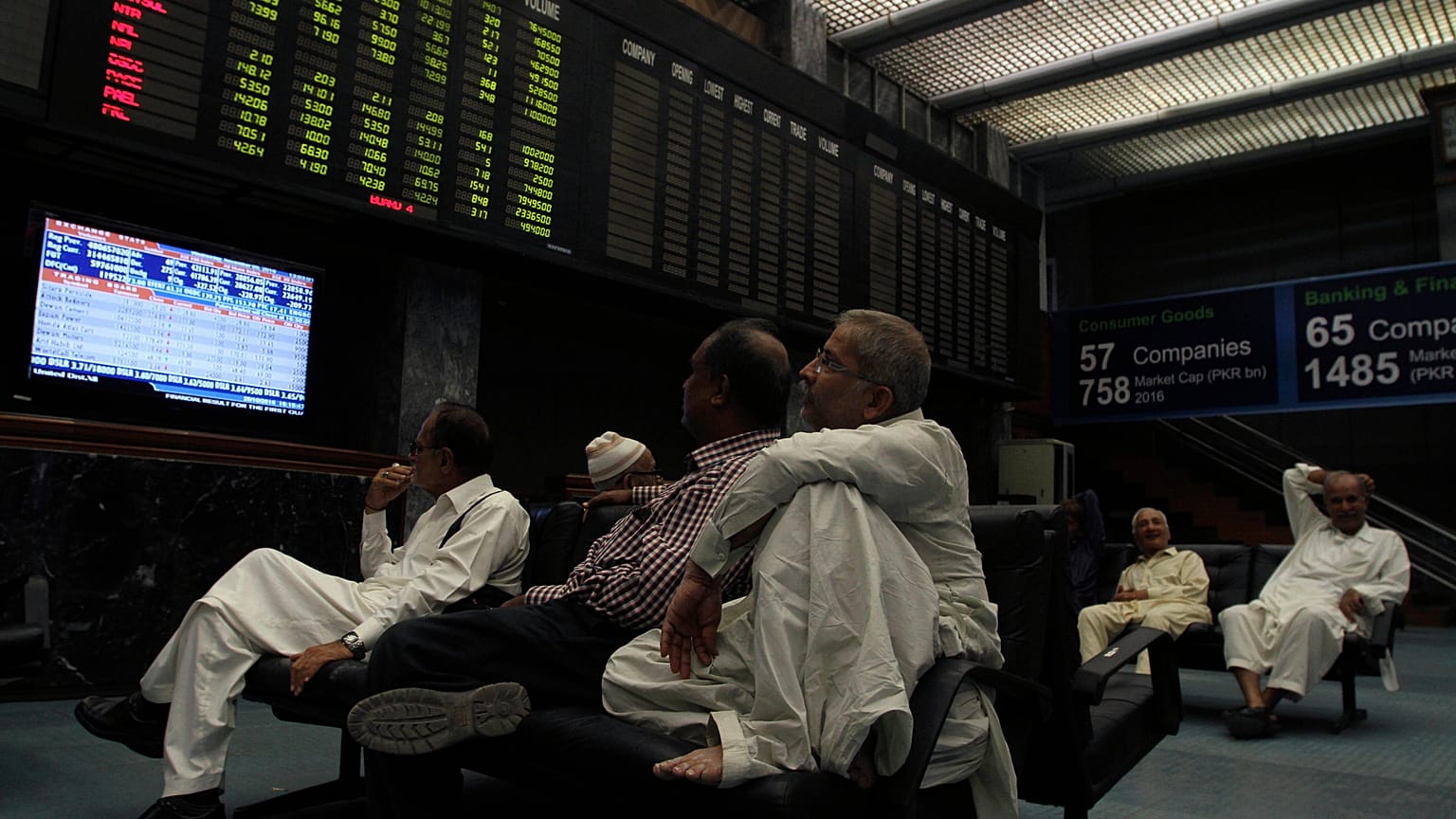 FILE: Pakistani stock brokers monitor the market at Karachi Stock Exchange in Karachi, Pakistan, Wednesday, Nov. 9, 2016.