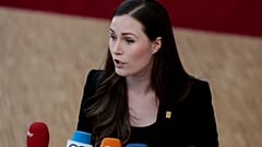 Finnish Prime Minister Sanna Marin speaks with the media as she arrives for an EU summit in Brussels in February.