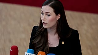 Finnish Prime Minister Sanna Marin speaks with the media as she arrives for an EU summit in Brussels in February.