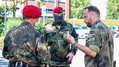 Soldiers of the German forces stay in front of the district hall, headquarters of the task force coordinating coronavirus test stations, in Warendorf, Germany, June 24, 2020.