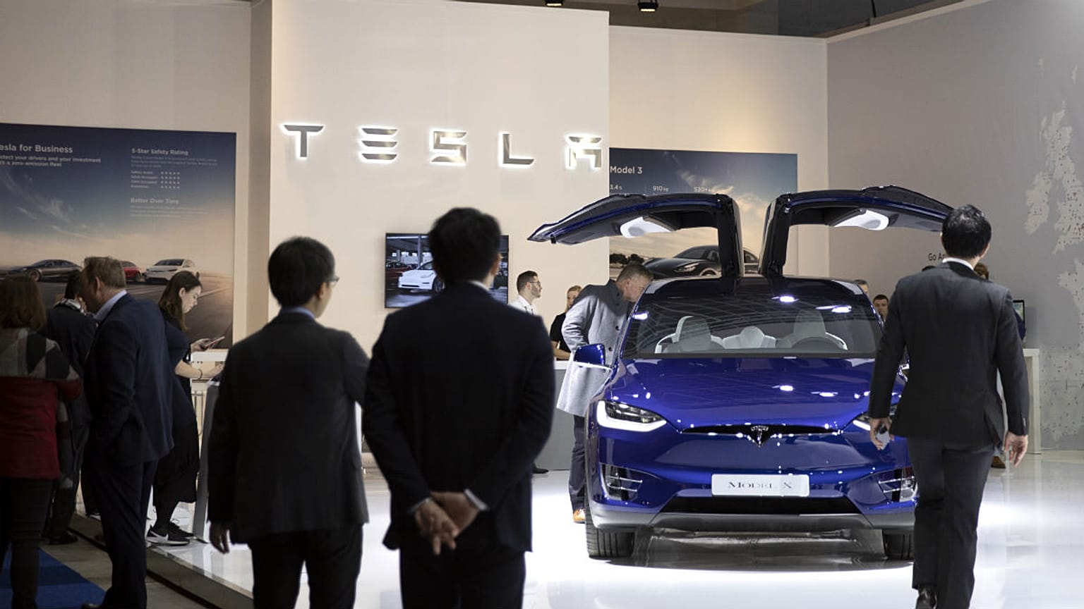 People view the new Tesla Model X during the Brussels Auto Show at the Expo in Brussels, Thursday, Jan. 9, 2020.