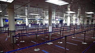 Empty halls in Terminal 2 of Charles de Gaulle international airport are pictured in Roissy, north of Paris, Thursday, May 14 2020.