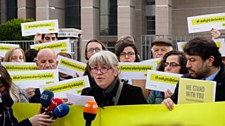 Protesters outside a court in Istanbul over the trial of Amnesty International activists