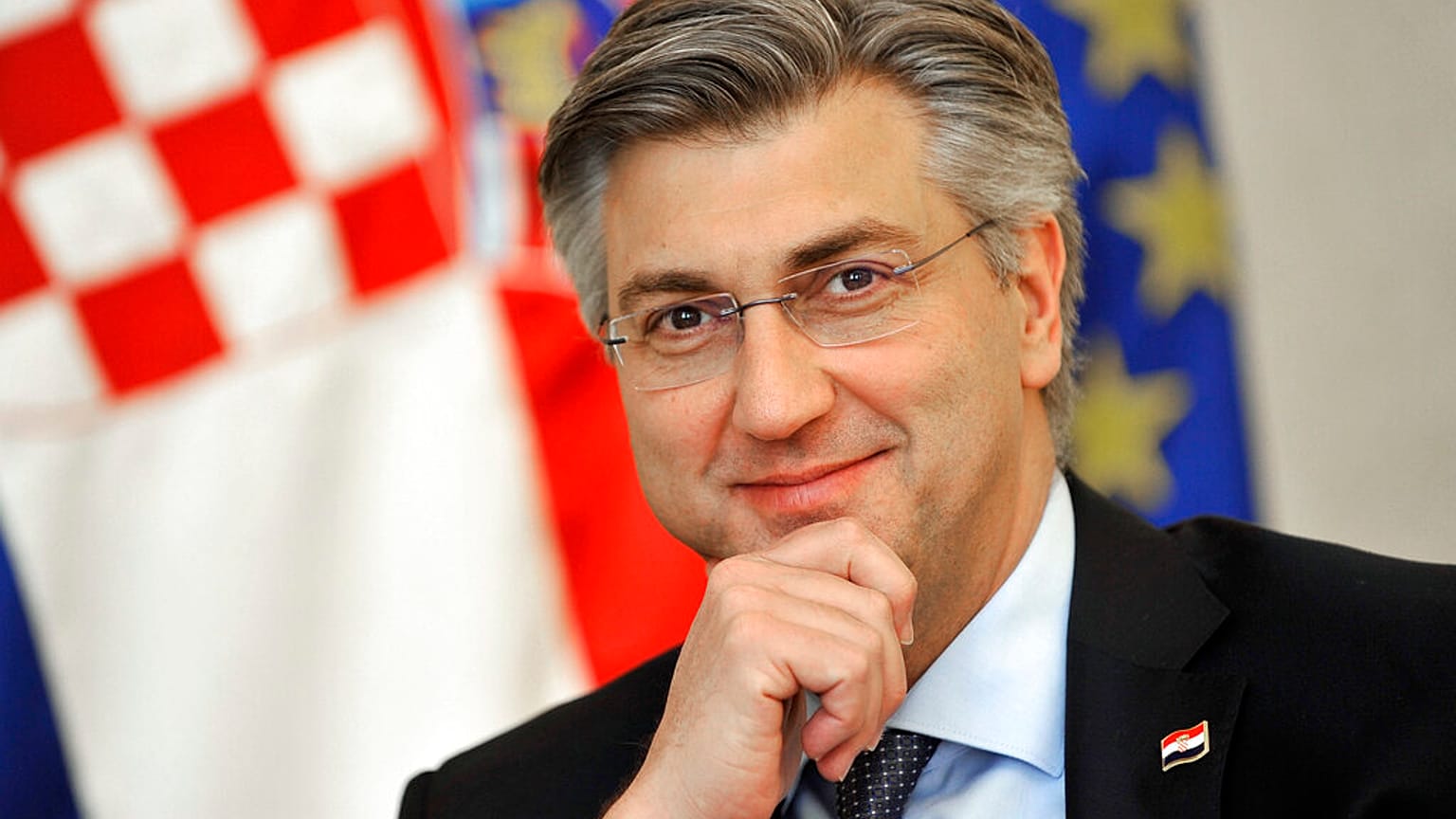Andrej Plenkovic, Croatia's Prime Minister incumbent smiles as he addresses the media in Zagreb, Croatia, Thursday, April 9, 2020