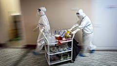 Medical workers in Belgrade bring medications to patients suffering from COVID-19