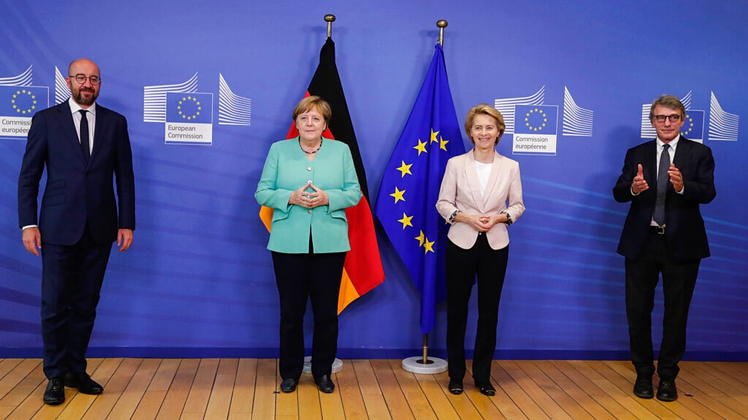 Charles Michel, Angela Merkel, Ursula von der Leyen and David Sassoli pose for photographers prior to a meeting at EU headquarters in Brussels.