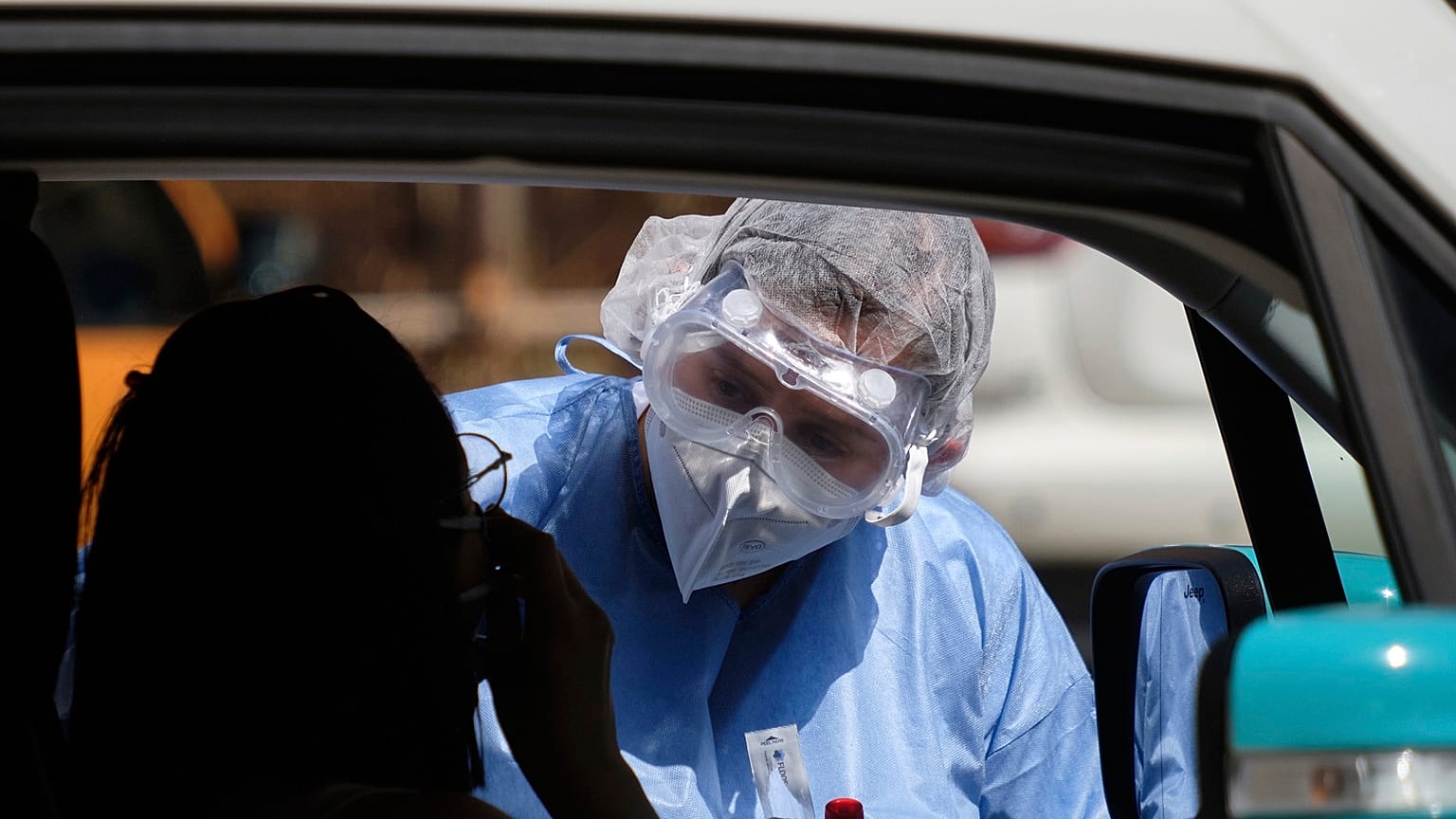 A medic takes swabs for COVID-19 in Rome on Monday July 6, 2020.