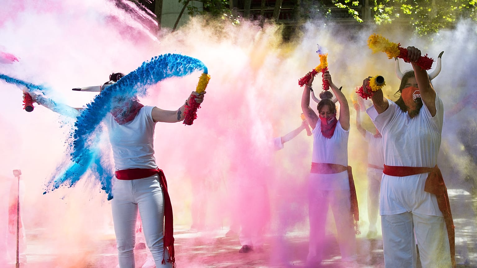 Pro-animal rights activists spread powder to celebrate the cancellation of this year’s San Fermin Festival’s bullfights and bull-running during a demonstration in Pamplona