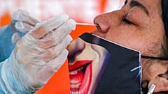 Taking a nasal swab sample in the Puente Alto neighborhood of Santiago, Chile, July 10, 2020
