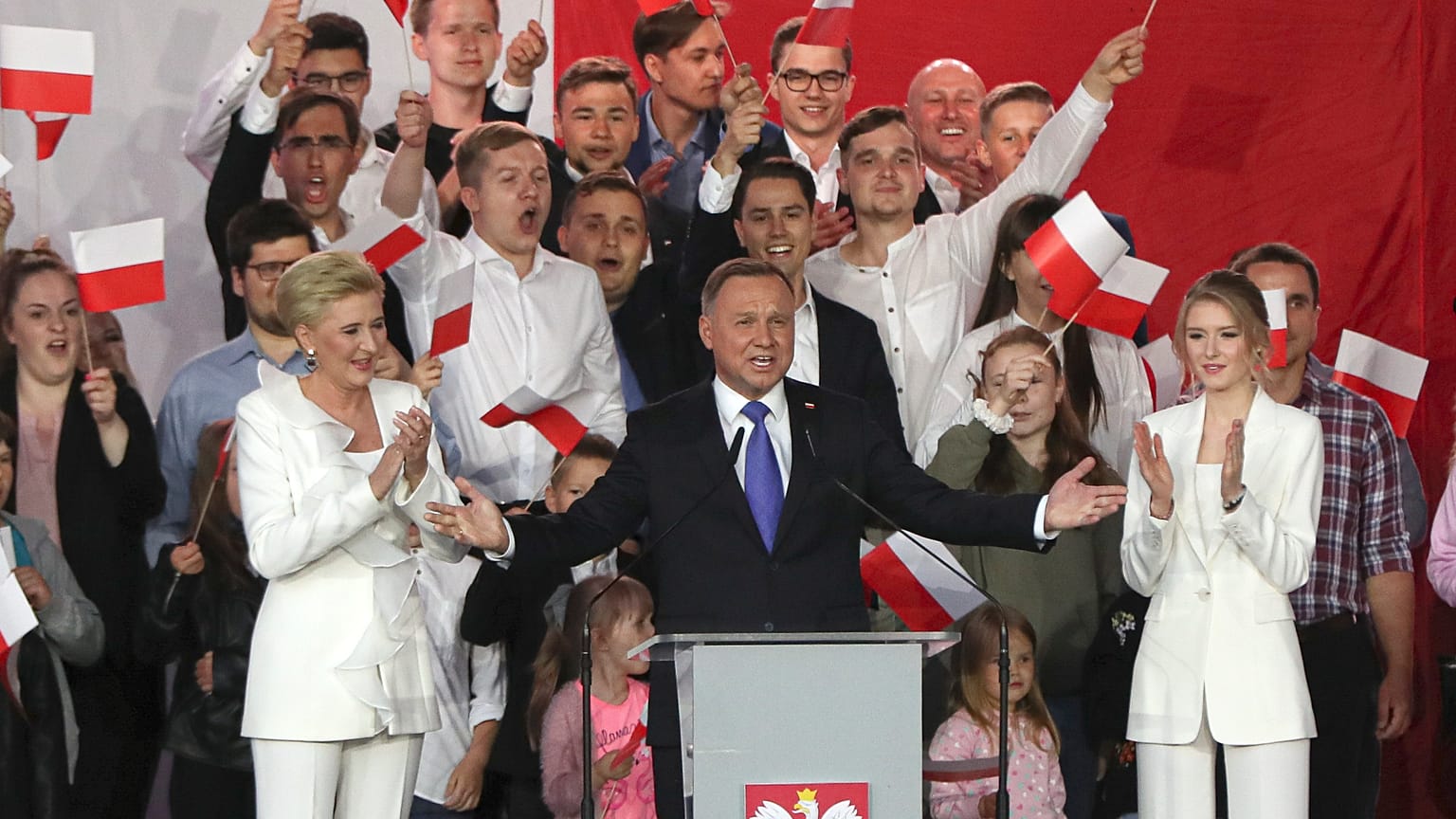 Incumbent President Andrzej Duda, center, gestures next to his wife Agata Kornhauser-Duda
