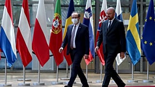 European Council President Charles Michel, right, walks with Kosovo's Prime Minister Avdullah Hoti before a meeting in Brussels in June