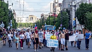 "Freedom for Sergei Furgal" and "Putin to Resign!" seen on posters during an unsanctioned protest on Sunday to support Sergei Furgal, Khabarovsk governor