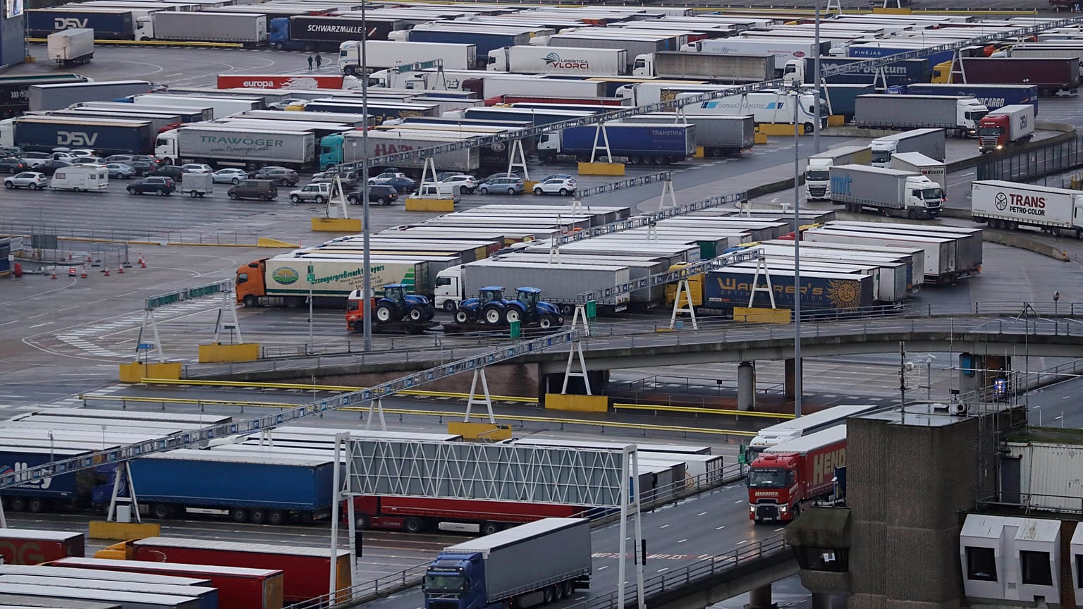 Lorries leave after disembarking a ferry as others wait to board on the morning after Brexit, Saturday Feb 1, 2020.