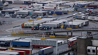 Lorries leave after disembarking a ferry as others wait to board on the morning after Brexit, Saturday Feb 1, 2020.