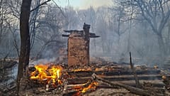 A house burns in the exclusion zone around the Chernobyl nuclear power plant, April 5, 2020