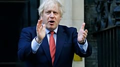 PM Boris Johnson applauds health and care workers during the UK's COVID-19 outbreak