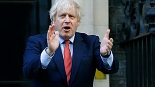 PM Boris Johnson applauds health and care workers during the UK's COVID-19 outbreak