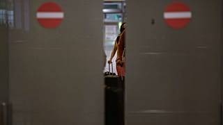 Passengers arrive at the Barcelona airport, Spain
