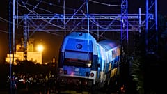 Rescuers work at the scene of a passenger and freight trains collision in Cesky Brod, east of Prague,