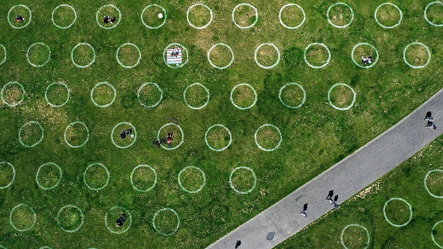 An aerial view shows painted circles for social distancing at the Rhine promenade in Dusseldorf, Germany. July 12, 2020