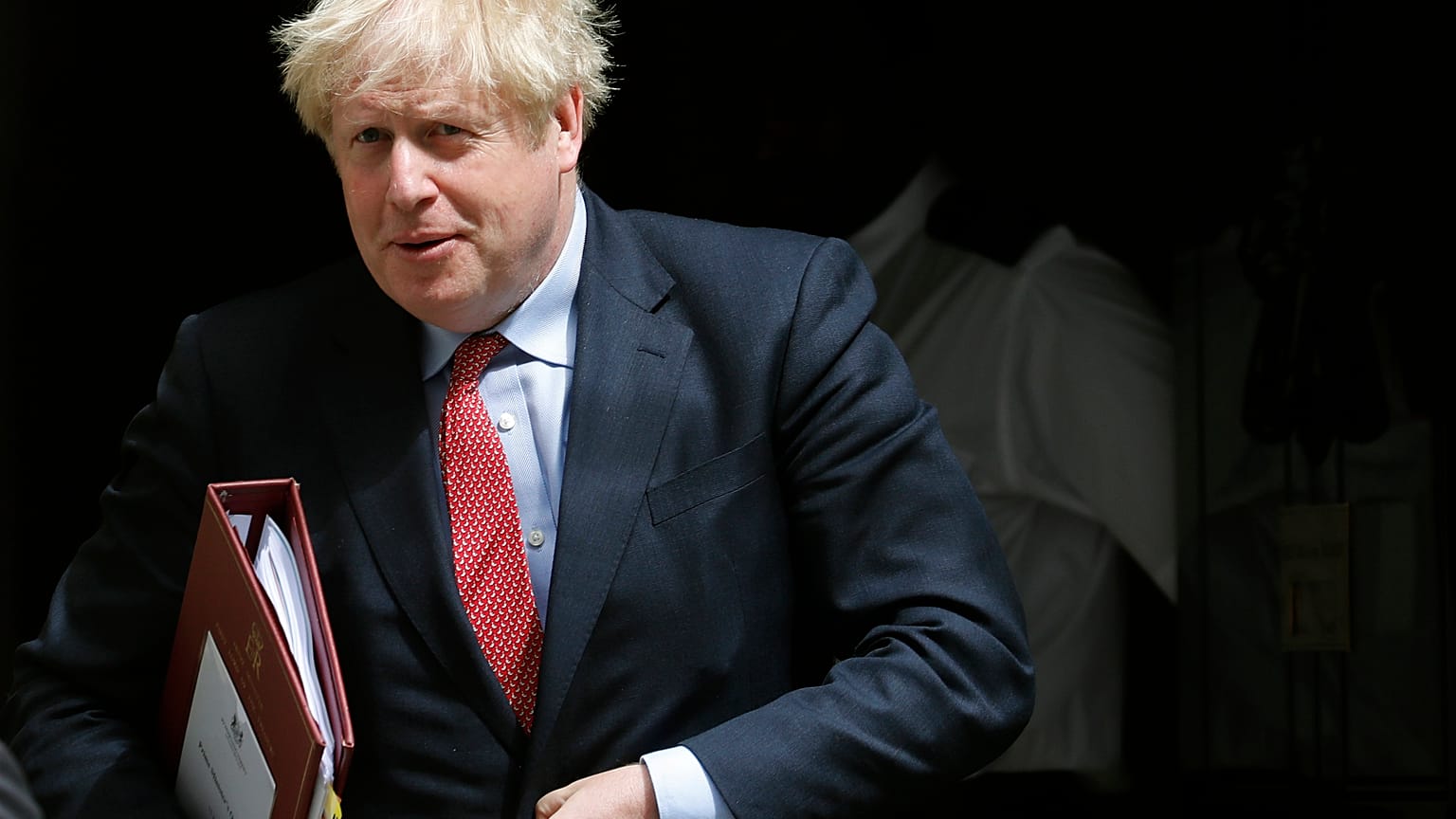 Britain's Prime Boris Johnson leaves 10 Downing Street to attend the weekly Prime Minister's Questions session, in parliament in London, Wednesday, July 15, 2020. 