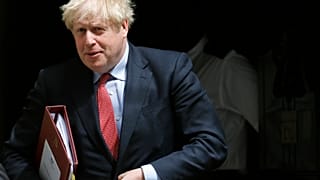 Britain's Prime Boris Johnson leaves 10 Downing Street to attend the weekly Prime Minister's Questions session, in parliament in London, Wednesday, July 15, 2020. 