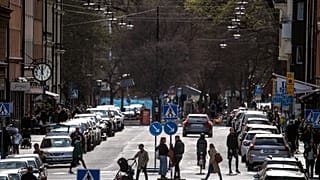 People walk on the streets, amid the coronavirus outbreak, in central Stockholm in April 2020.