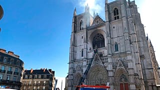 Fire fighters brigade work to extinguish the blaze at the Gothic St. Peter and St. Paul Cathedral, in Nantes, western France, Saturday, July 18, 2020