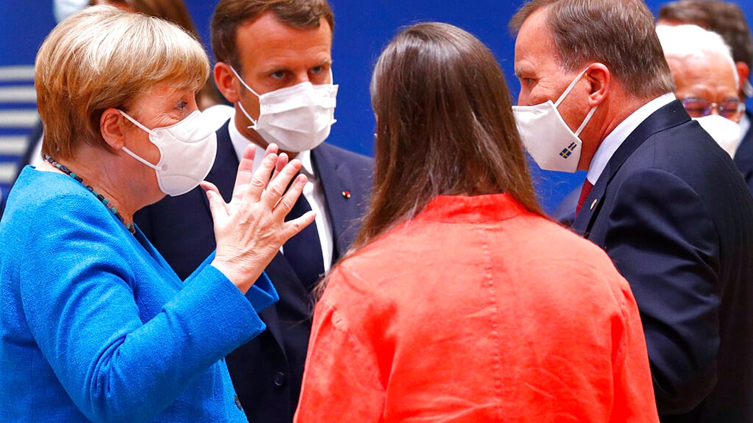 German Chancellor Angela Merkel speaks with French President Emmanuel Macron, Finland's Prime Minister Sanna Marin, and Sweden's Prime Minister Stefan Lofven, during EU Summit